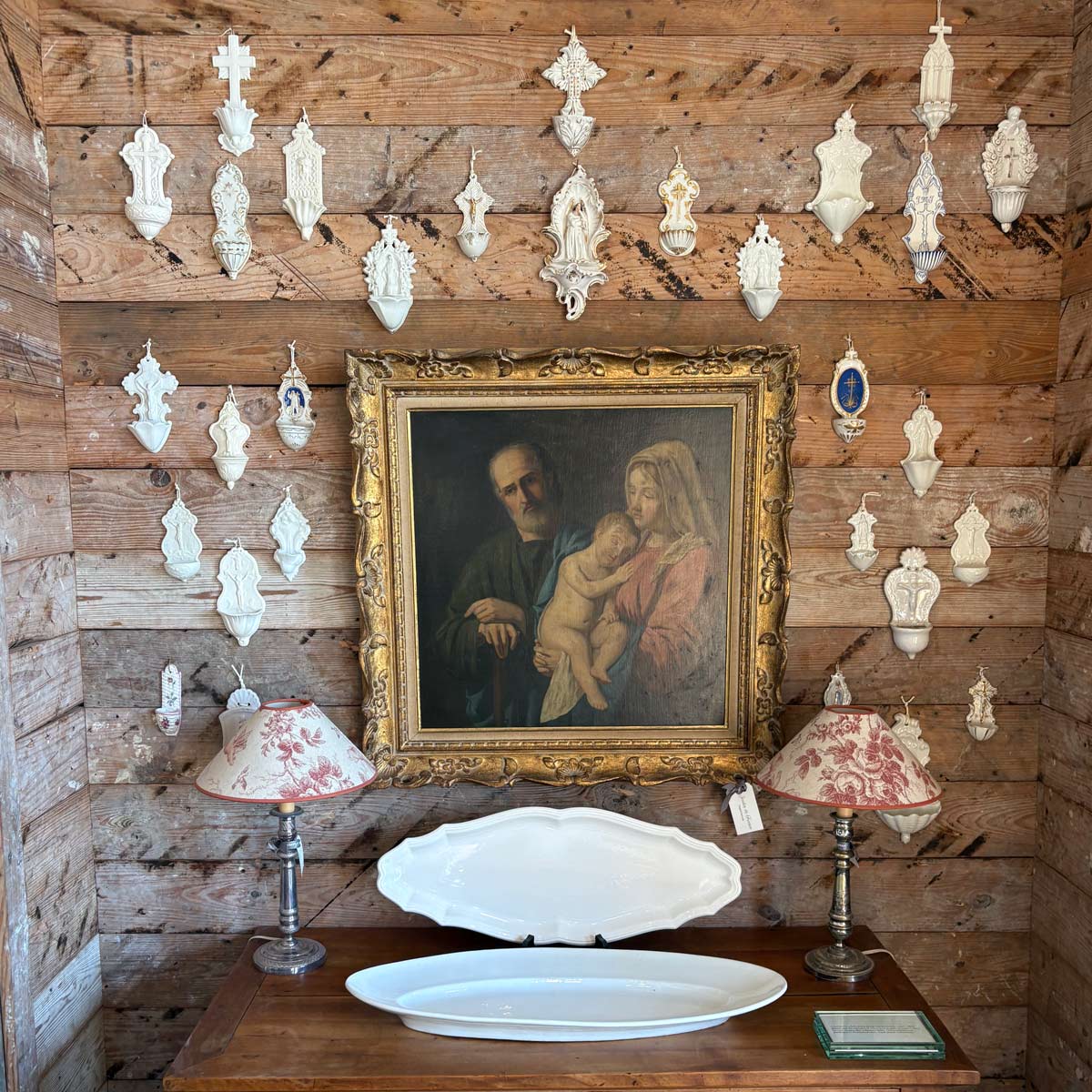A vignette of vintage holy water bénitier fonts at our Compound Ln location