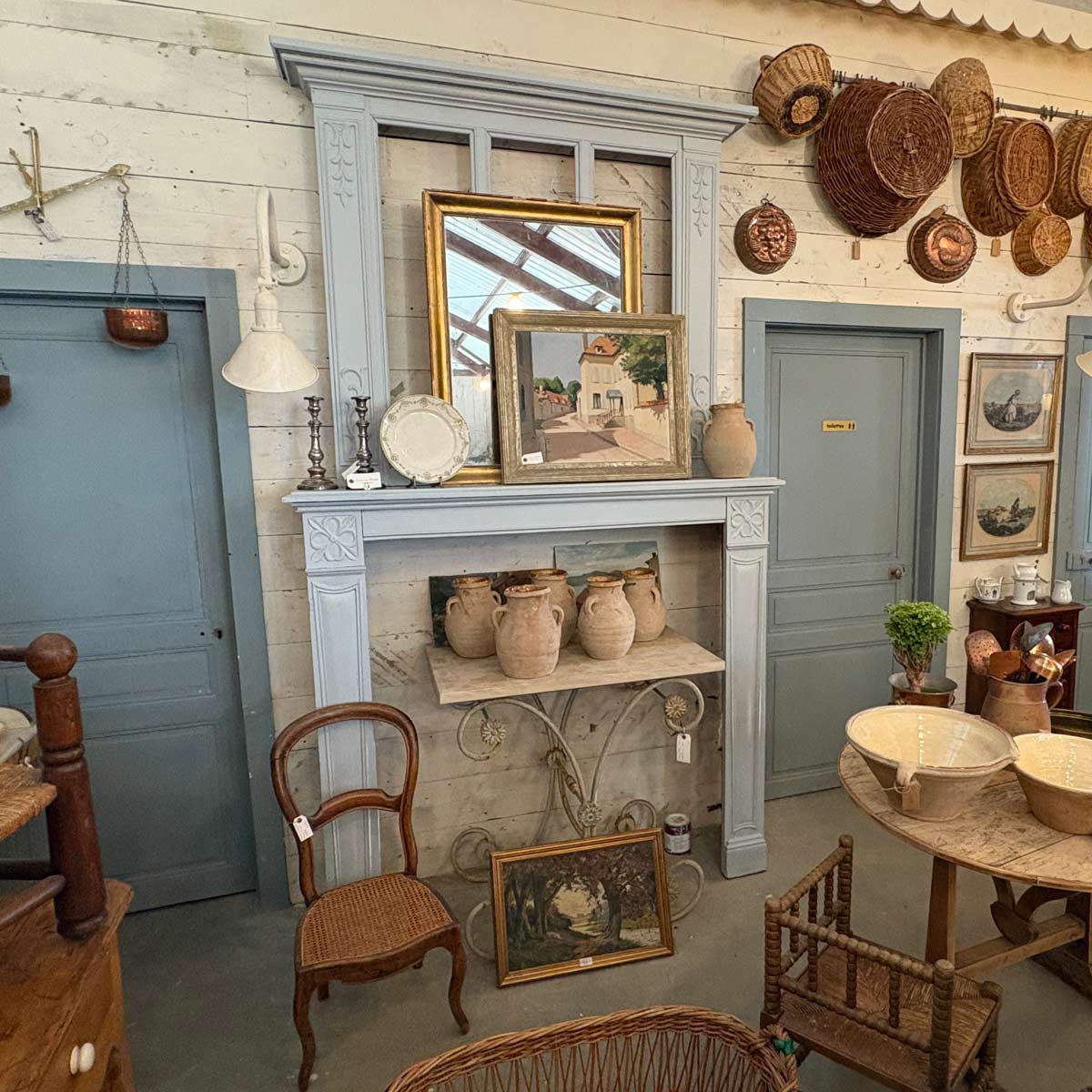 A hearth and mantel vignette at our Compound Ln location