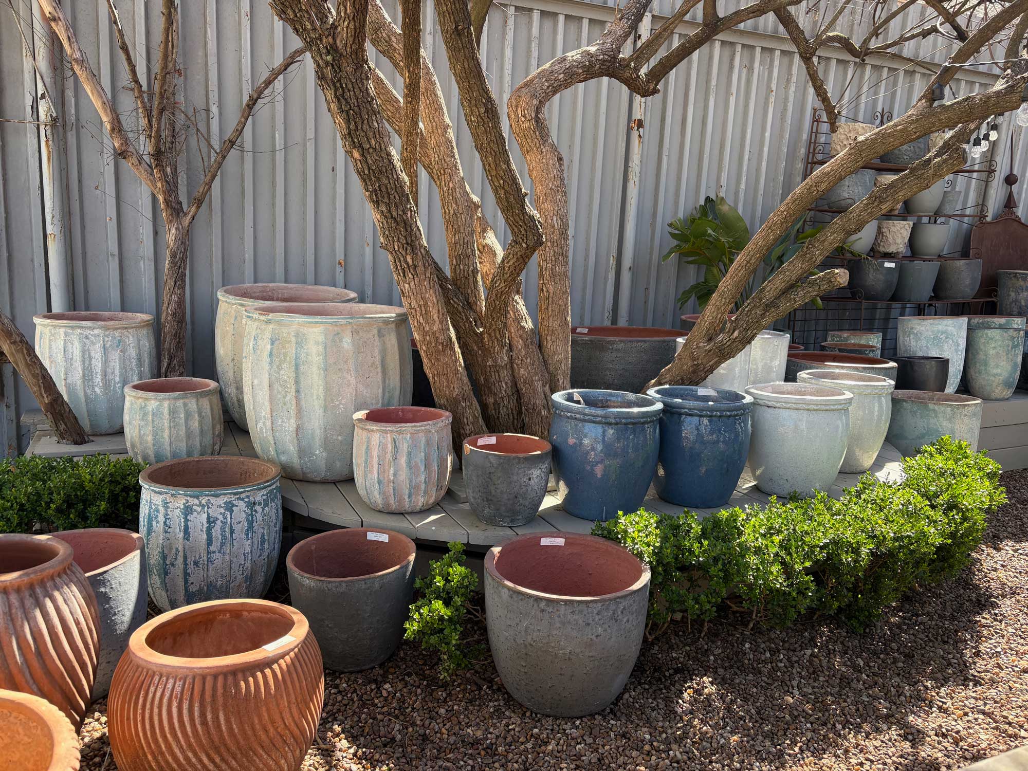A view of many kinds of pots and planters